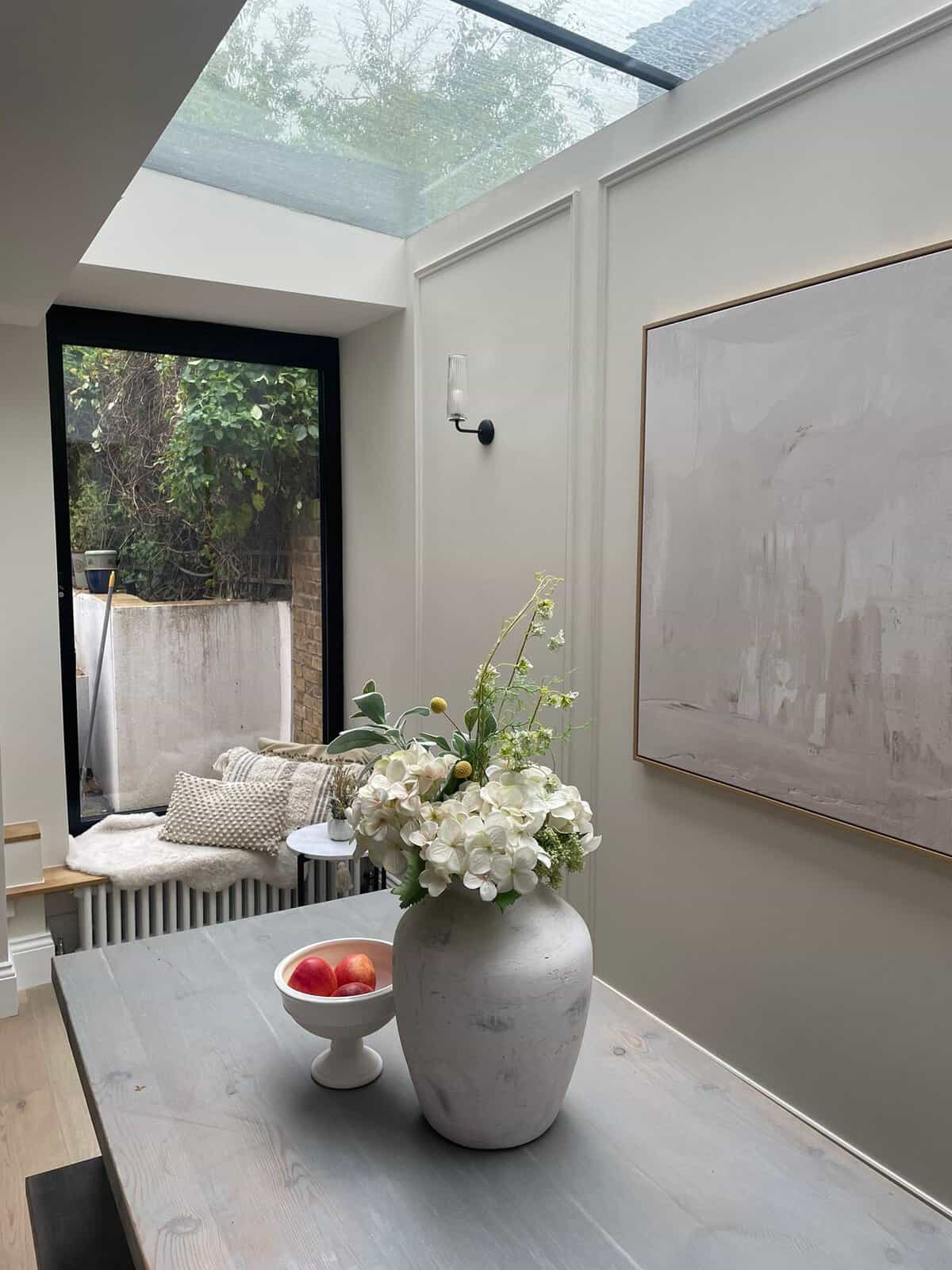 Roof light over the dining table in a rear extension with panelled walls, Corbyn Street N4