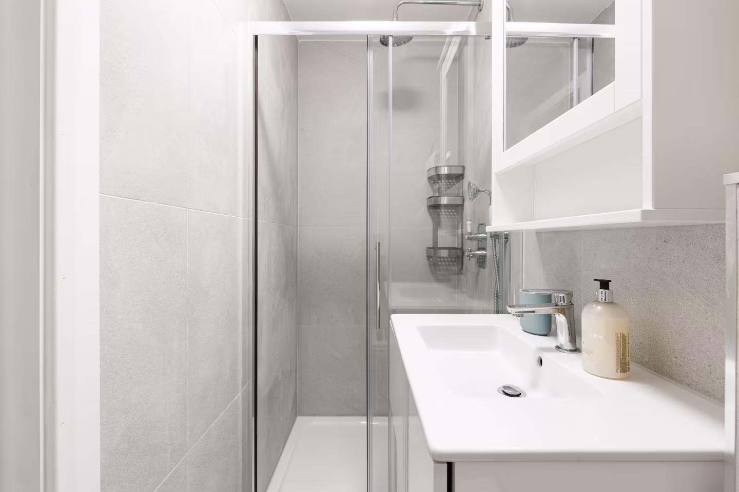 Shower room with glass enclosure, grey stone effect tiles and mirror cabinet, St John's Wood