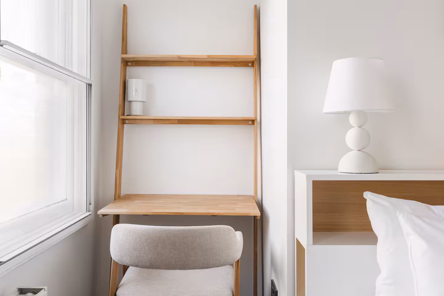 Built in desk nook with ladder shelf beside a bed, Allitsen Road NW8 refurbishment