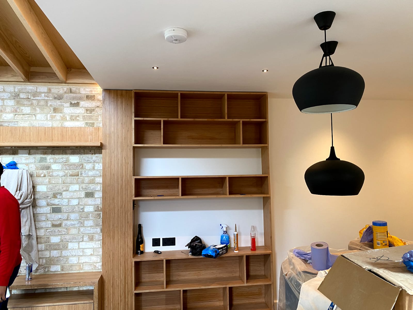 Fitted oak shelving unit with black pendant lights, Staveley Road Chiswick W4