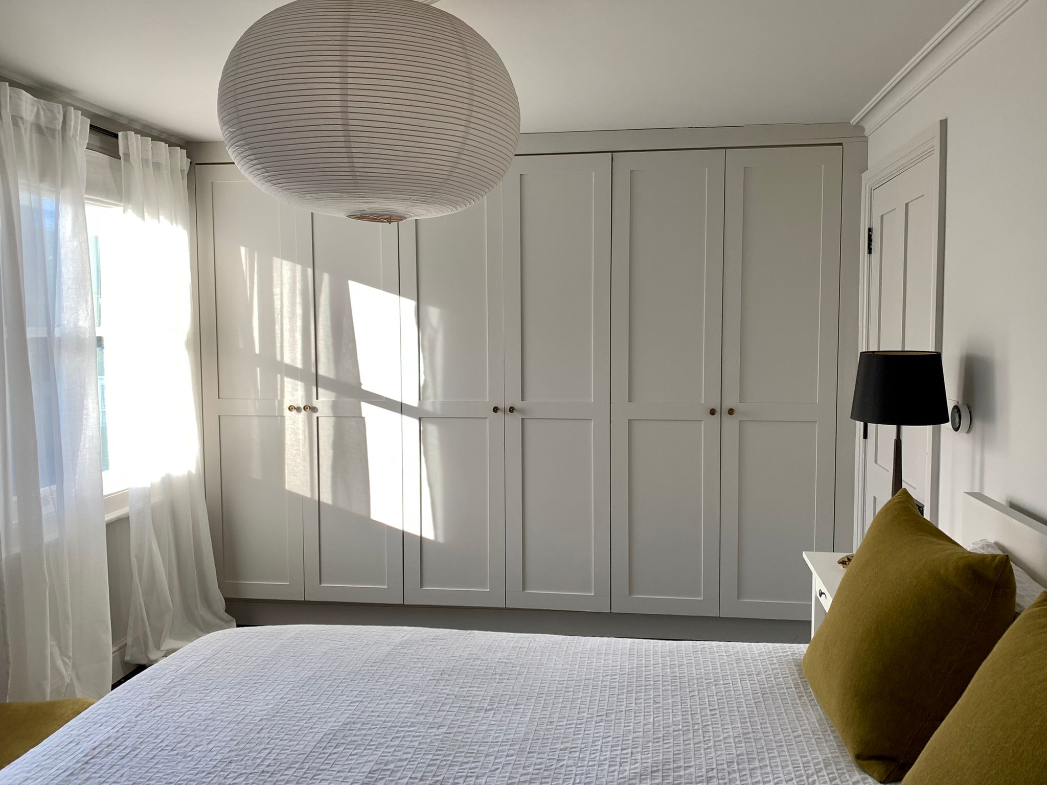Bedroom with fitted shaker wardrobes and sash windows, Hanwell W7 renovation