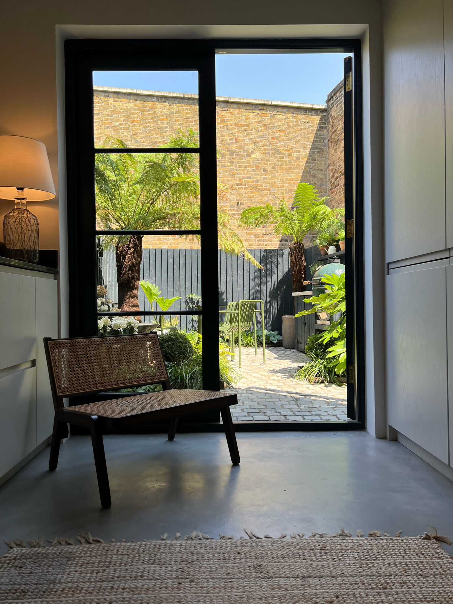 Black framed glazed door from the rear room onto the garden, Clairville Gardens Hanwell